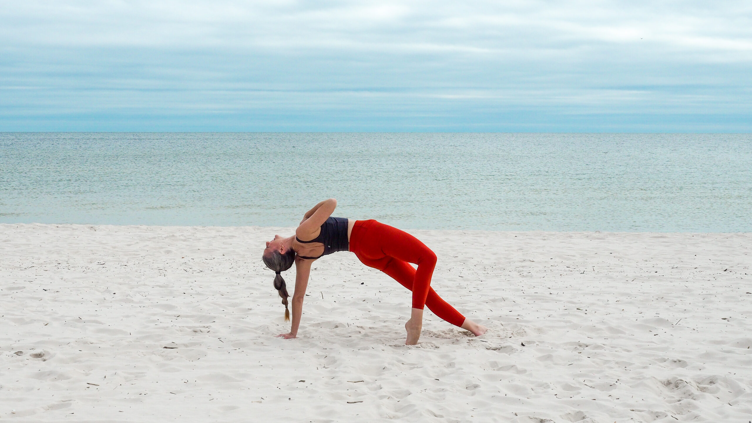 Wild Thing Pose on the beach - yoga